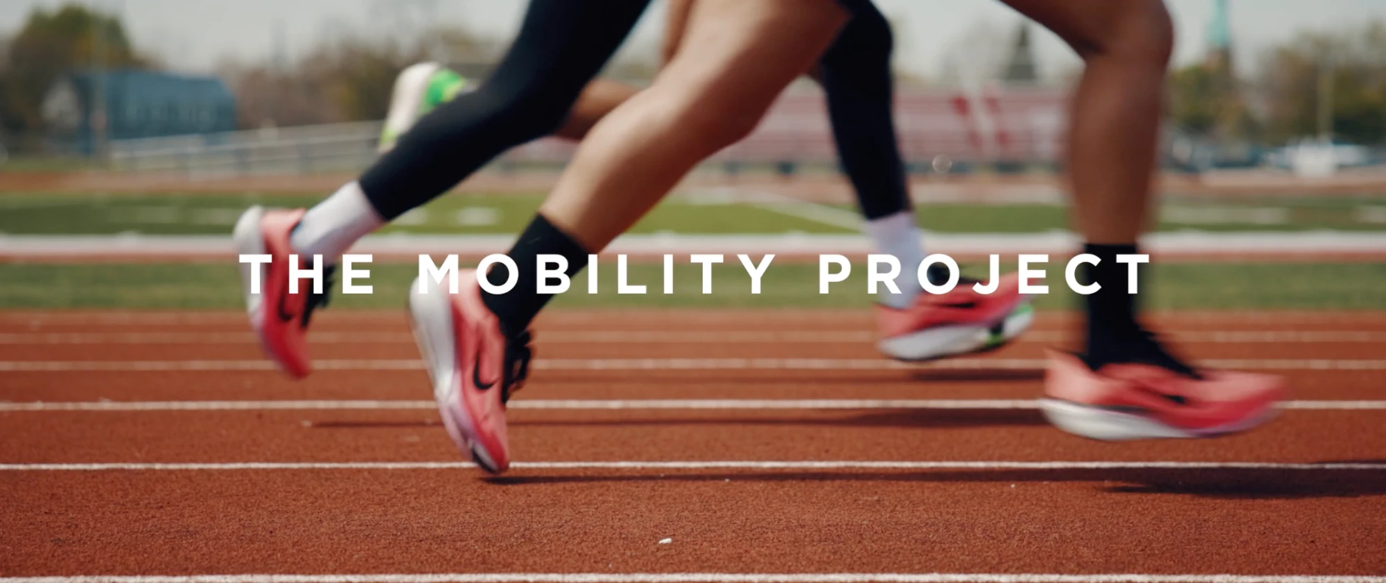 Title card for The Mobility Project over runners' feet on a red track